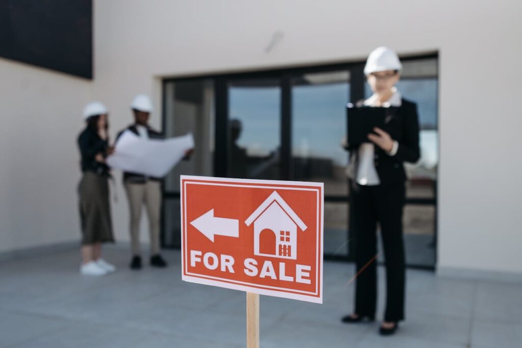 Red For Sale Sign by House